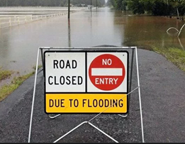 Road closed due to flooding sign